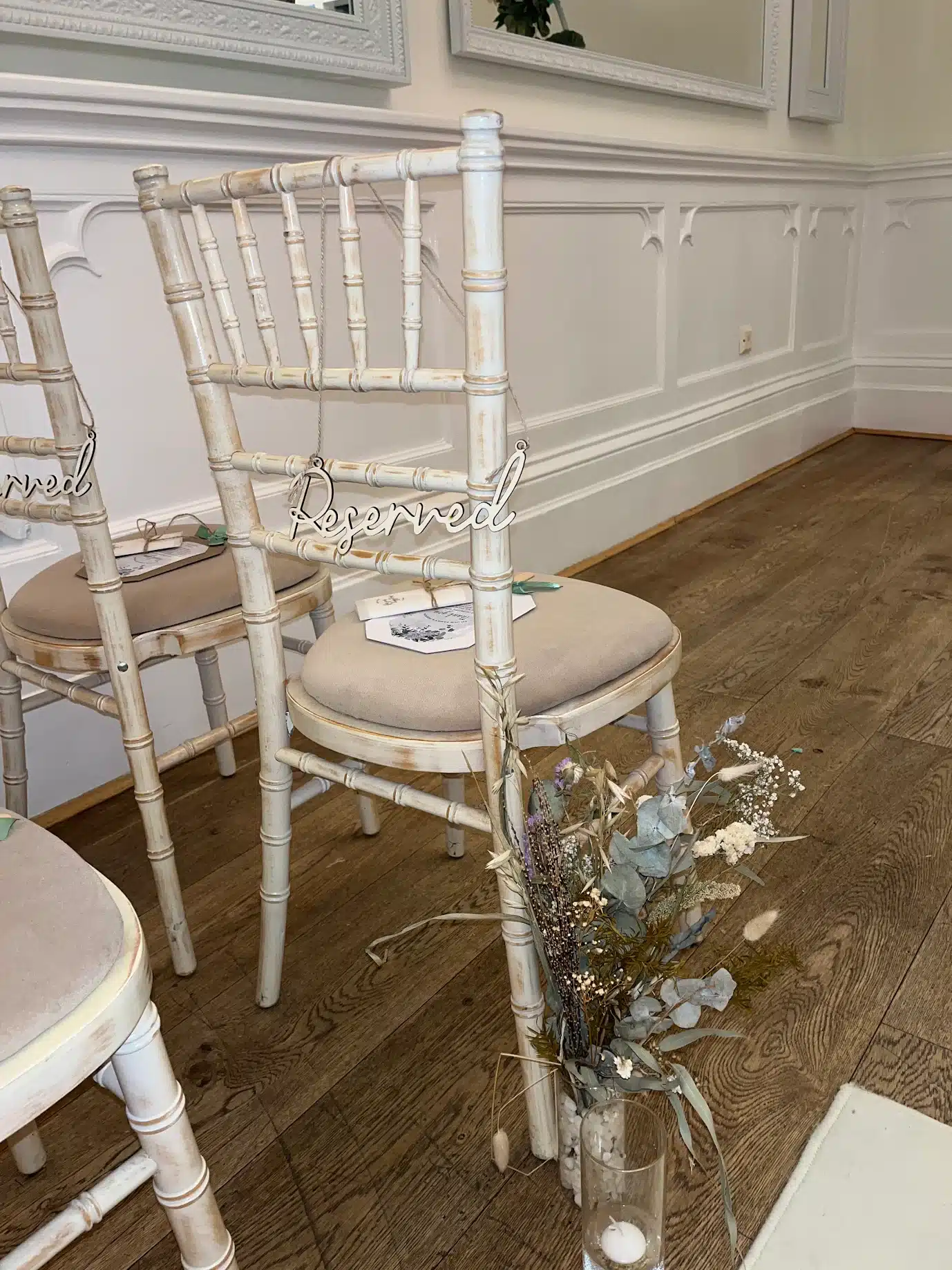 Limewash Chiavari chairs styled for an elegant wedding reception